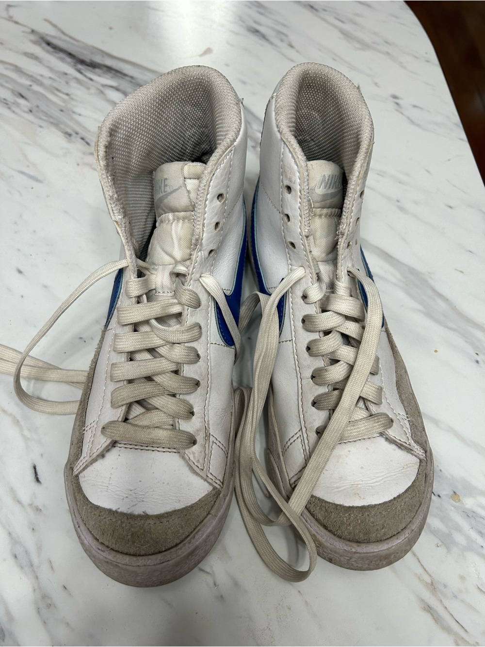 Nike Kids High-Top Sneakers in White with Blue Swoosh